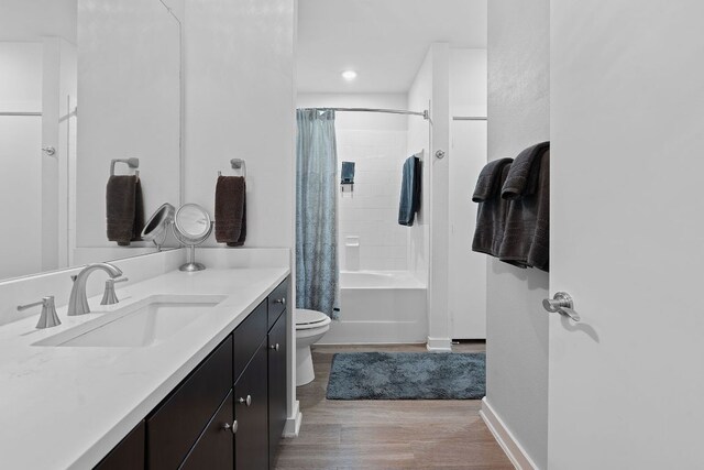 1900 Barton Springs Rd Unit 3007, Austin, TX 78704 - bathroom with vanity, toilet, wood finished floors, shower / bathtub combination with curtain, and baseboards