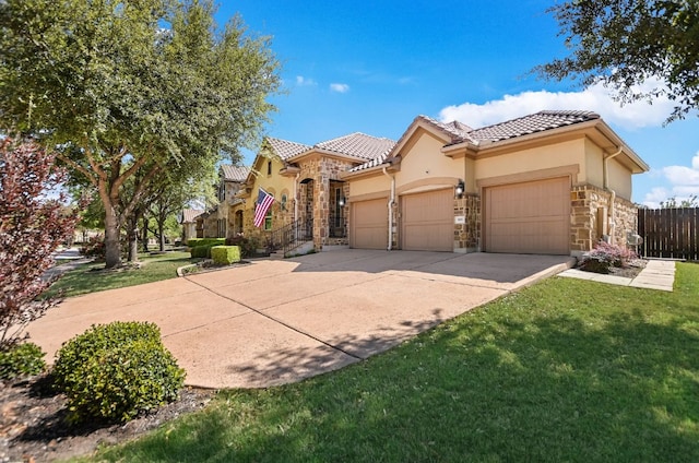 300 Horseback Holw, Austin, TX 78732 - mediterranean / spanish-style house featuring stone siding, an attached garage, a tiled roof, and stucco siding