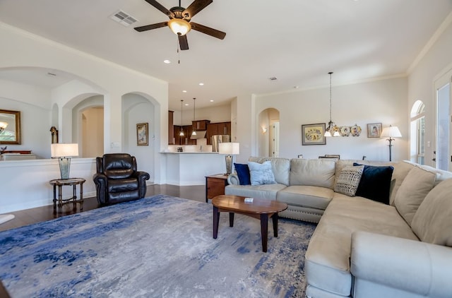 300 Horseback Holw, Austin, TX 78732 - living room with ceiling fan, wood finished floors, crown molding, arched walkways, and recessed lighting