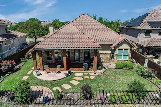 300 Horseback Holw, Austin, TX 78732 - back of property with a tiled roof, a fenced backyard, a chimney, stucco siding, and stone siding