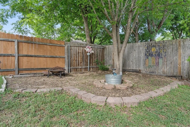 2300 Rick Whinery Dr, Austin, TX 78728 - fenced backyard featuring a fire pit