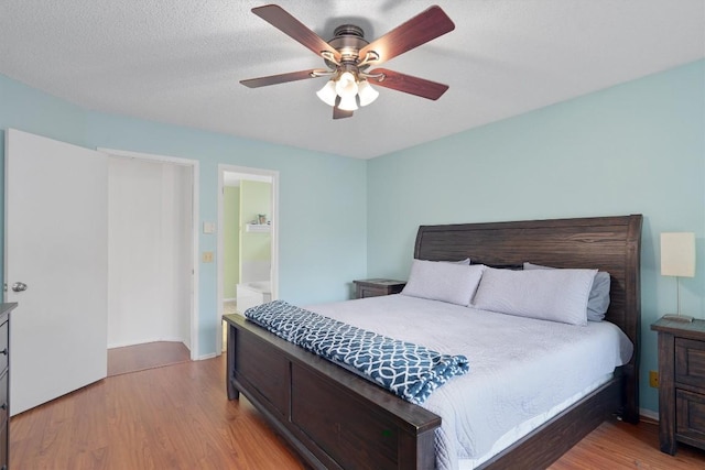 2300 Rick Whinery Dr, Austin, TX 78728 - bedroom with light wood-style floors, ceiling fan, and baseboards