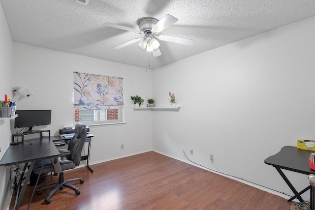 2300 Rick Whinery Dr, Austin, TX 78728 - office featuring wood finished floors, a ceiling fan, and a textured ceiling