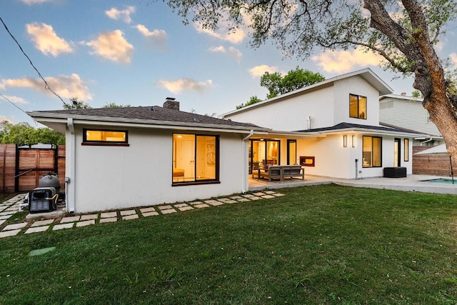 4000 Greystone Dr, Austin, TX 78731 - back of house featuring stucco siding, a patio, a chimney, and outdoor lounge area