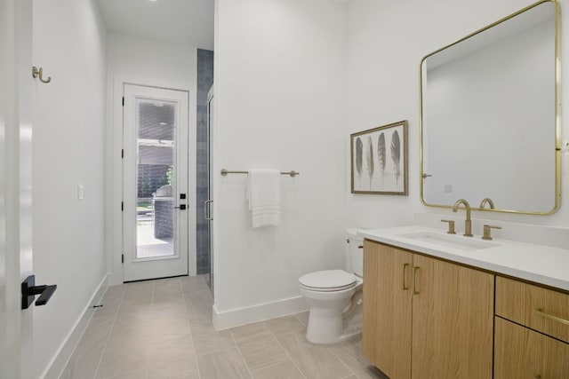 full bath featuring tile patterned floors, toilet, vanity, baseboards, and a stall shower
