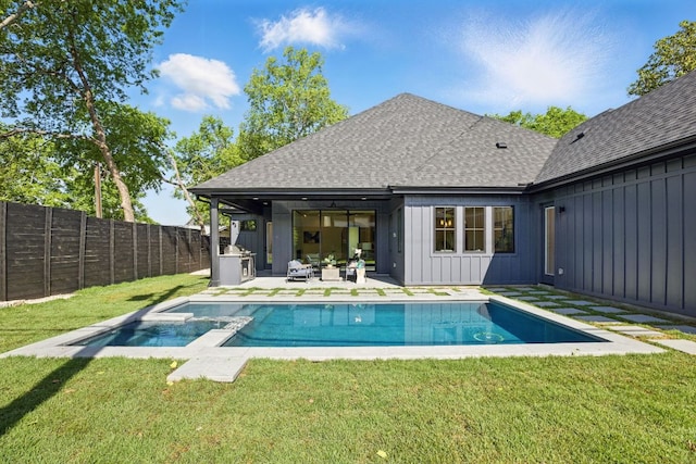 back of house with board and batten siding, a fenced backyard, a shingled roof, a patio, and a lawn