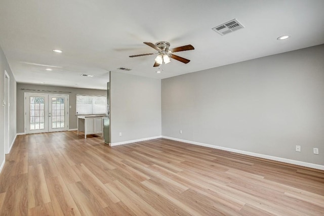 6603 Krollton Dr, Austin, TX 78745 - spare room featuring recessed lighting, a ceiling fan, light wood-style flooring, and french doors