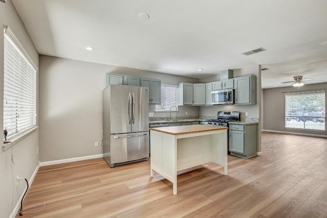 6603 Krollton Dr, Austin, TX 78745 - kitchen with appliances with stainless steel finishes, wooden counters, light wood-style flooring, healthy amount of natural light, and recessed lighting