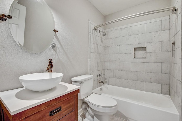 6603 Krollton Dr, Austin, TX 78745 - full bathroom featuring a textured wall, vanity, toilet, and washtub / shower combination