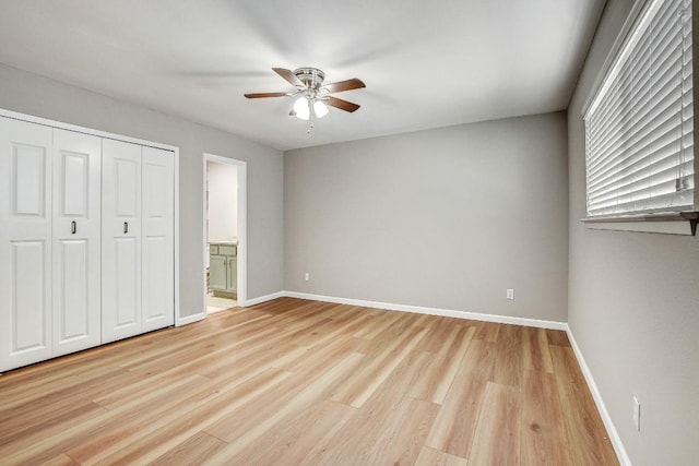 6603 Krollton Dr, Austin, TX 78745 - unfurnished bedroom featuring light wood-style floors, ensuite bathroom, ceiling fan, and a closet
