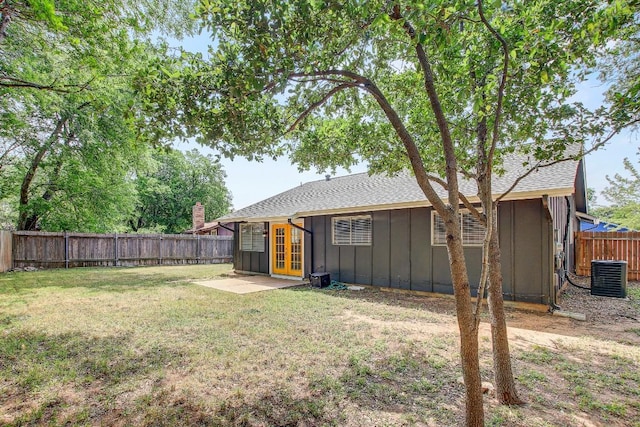6603 Krollton Dr, Austin, TX 78745 - view of yard featuring french doors, central AC, and a patio area