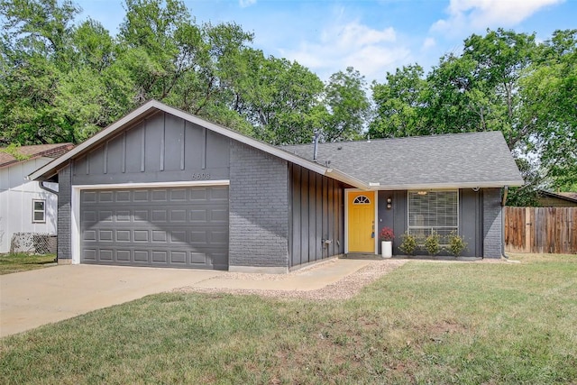 6603 Krollton Dr, Austin, TX 78745 - view of front of property featuring board and batten siding, brick siding, an attached garage, driveway, and a shingled roof
