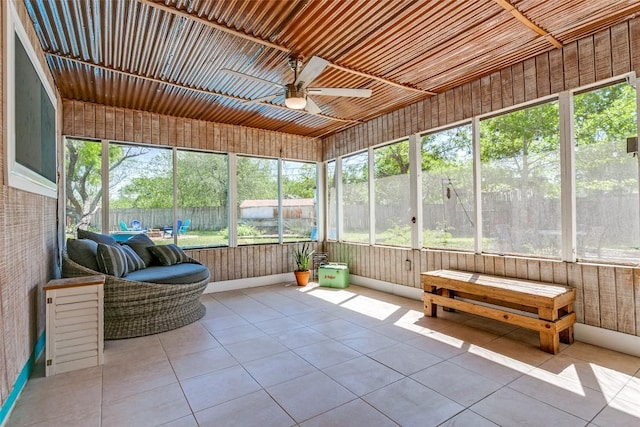 sunroom / solarium with ceiling fan and plenty of natural light