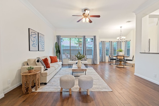 8104 Isaac Pryor Dr, Austin, TX 78749 - living area featuring wood finished floors, visible vents, baseboards, and ceiling fan with notable chandelier