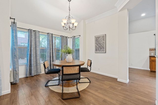8104 Isaac Pryor Dr, Austin, TX 78749 - dining space featuring a chandelier, wood finished floors, ornamental molding, lofted ceiling, and recessed lighting