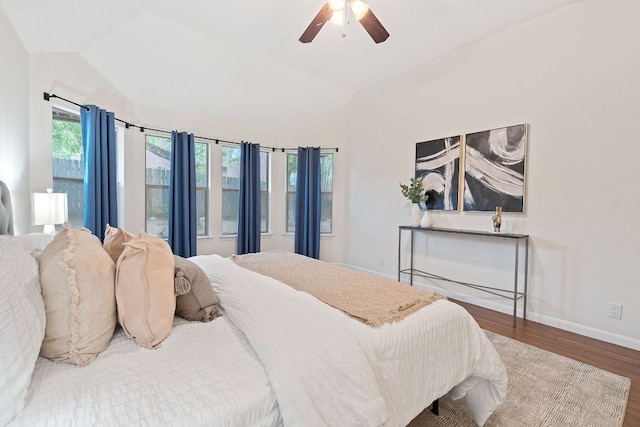 8104 Isaac Pryor Dr, Austin, TX 78749 - bedroom with lofted ceiling, baseboards, wood finished floors, and multiple windows