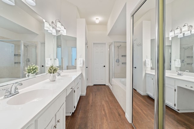 8104 Isaac Pryor Dr, Austin, TX 78749 - full bathroom with wood finished floors, a stall shower, and a sink