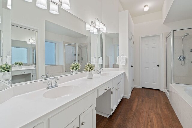8104 Isaac Pryor Dr, Austin, TX 78749 - bathroom featuring a garden tub, a sink, and a stall shower
