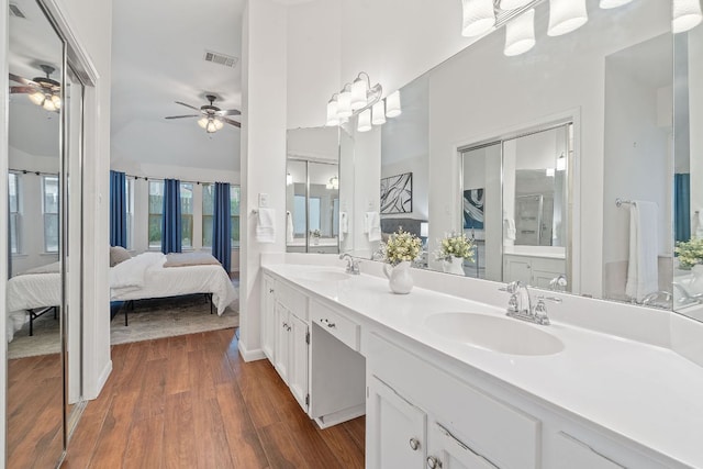 8104 Isaac Pryor Dr, Austin, TX 78749 - full bath featuring a sink, ensuite bathroom, visible vents, wood finished floors, and ceiling fan