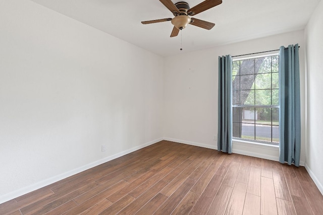 8104 Isaac Pryor Dr, Austin, TX 78749 - spare room with wood finished floors, a healthy amount of sunlight, baseboards, and ceiling fan