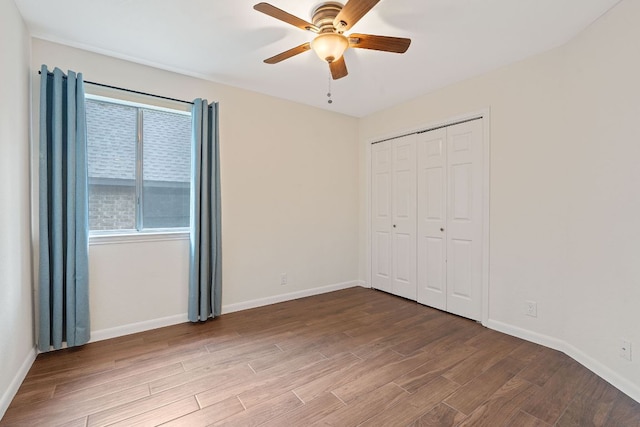 8104 Isaac Pryor Dr, Austin, TX 78749 - unfurnished bedroom featuring wood finished floors, a closet, a ceiling fan, and baseboards