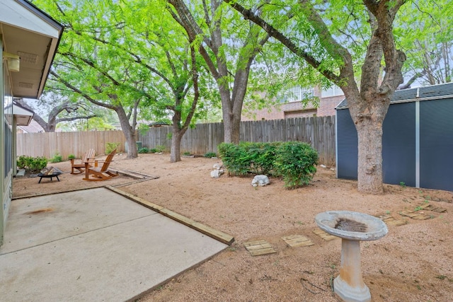 8104 Isaac Pryor Dr, Austin, TX 78749 - fenced backyard with a patio and a fire pit