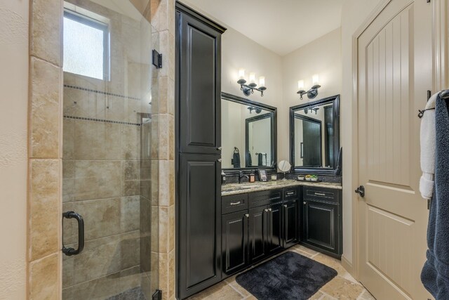 full bath with vanity and a stall shower