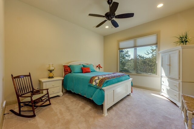 bedroom with light carpet, a ceiling fan, baseboards, and recessed lighting