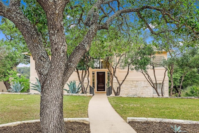 20718 Camel Back St, Lago Vista, TX 78645 - view of front of home with a front lawn and stucco siding