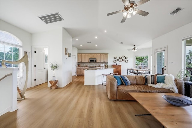 20718 Camel Back St, Lago Vista, TX 78645 - living area featuring ceiling fan, healthy amount of natural light, light wood-type flooring, recessed lighting, and lofted ceiling