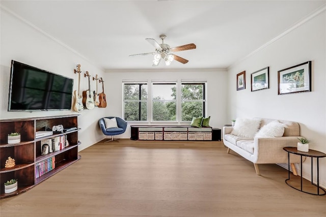 20718 Camel Back St, Lago Vista, TX 78645 - living area with crown molding, ceiling fan, and wood finished floors