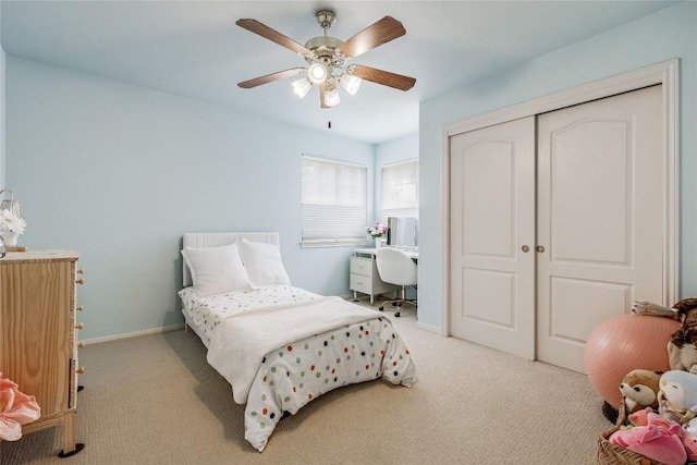 20718 Camel Back St, Lago Vista, TX 78645 - bedroom with light colored carpet, a closet, a ceiling fan, and baseboards