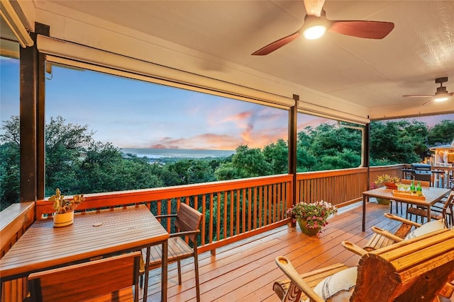 20718 Camel Back St, Lago Vista, TX 78645 - deck at dusk featuring outdoor dining area and a ceiling fan