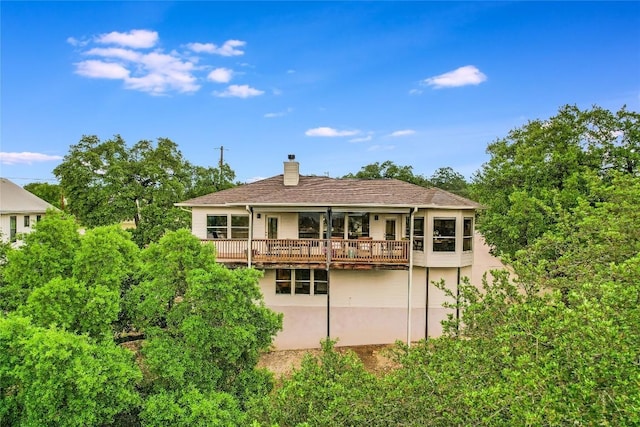 20718 Camel Back St, Lago Vista, TX 78645 - rear view of house featuring a chimney and stucco siding