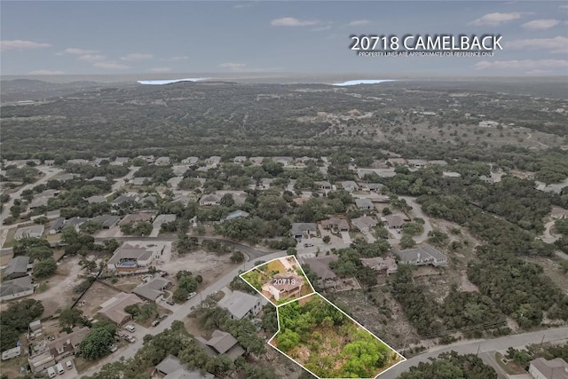 20718 Camel Back St, Lago Vista, TX 78645 - aerial view of residential area featuring property boundaries highlighted and a mountain backdrop