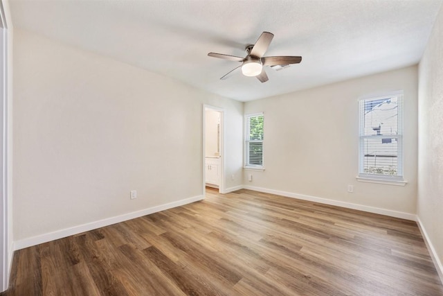11932 Shropshire Blvd, Austin, TX 78753 - empty room featuring wood finished floors, baseboards, and ceiling fan