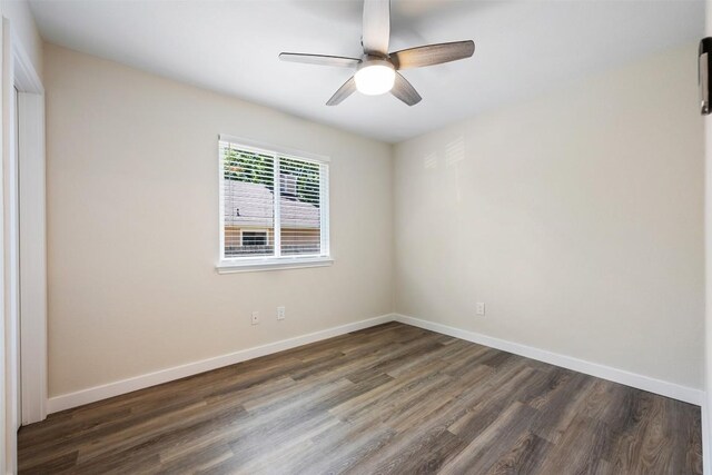 unfurnished room featuring baseboards, a ceiling fan, and wood finished floors