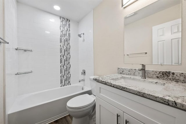 11932 Shropshire Blvd, Austin, TX 78753 - bathroom featuring vanity, toilet, shower / tub combination, wood finished floors, and recessed lighting