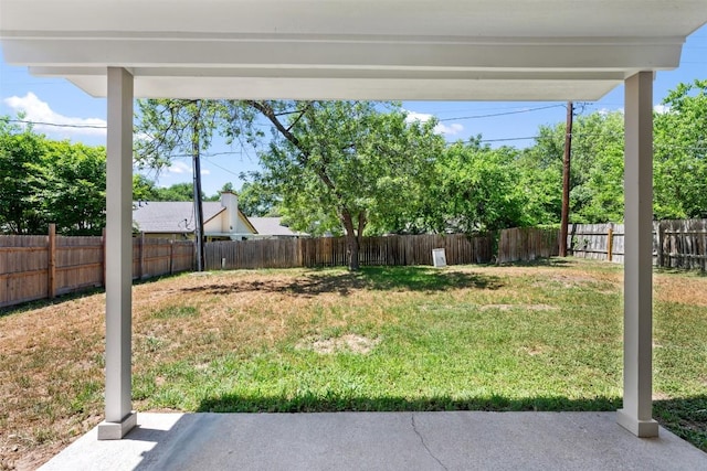 view of yard featuring a patio and a fenced backyard