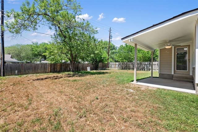 view of yard with a patio area, a ceiling fan, and a fenced backyard