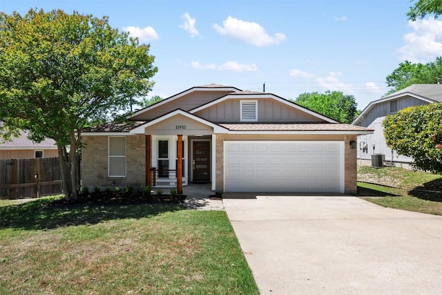 11932 Shropshire Blvd, Austin, TX 78753 - view of front of home featuring brick siding, central AC, concrete driveway, a garage, and covered porch