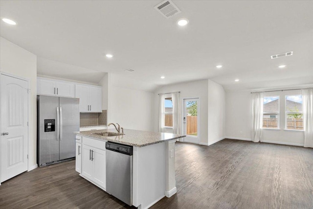 136 Medinah Ln, San Marcos, TX 78666 - kitchen with a sink, white cabinetry, appliances with stainless steel finishes, and dark wood finished floors