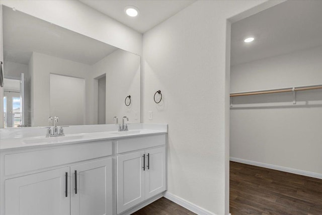 136 Medinah Ln, San Marcos, TX 78666 - full bath featuring baseboards, wood finished floors, and a sink