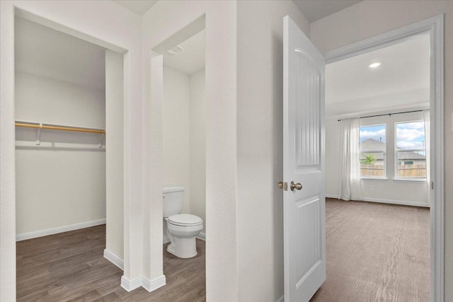 136 Medinah Ln, San Marcos, TX 78666 - bathroom with toilet, wood finished floors, and baseboards