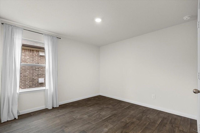 136 Medinah Ln, San Marcos, TX 78666 - spare room featuring dark wood finished floors, baseboards, and recessed lighting