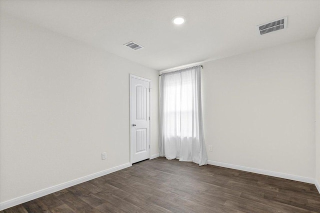 136 Medinah Ln, San Marcos, TX 78666 - empty room featuring baseboards, dark wood-type flooring, and visible vents