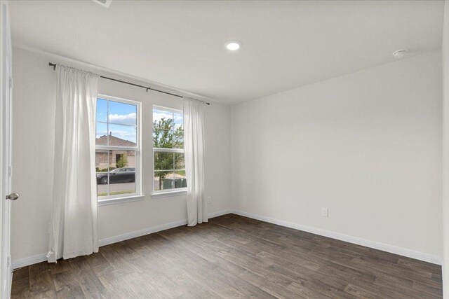 136 Medinah Ln, San Marcos, TX 78666 - spare room featuring recessed lighting, wood finished floors, and baseboards
