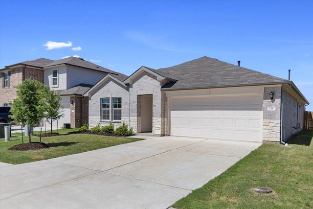 136 Medinah Ln, San Marcos, TX 78666 - ranch-style home with a garage, driveway, stone siding, and a front lawn