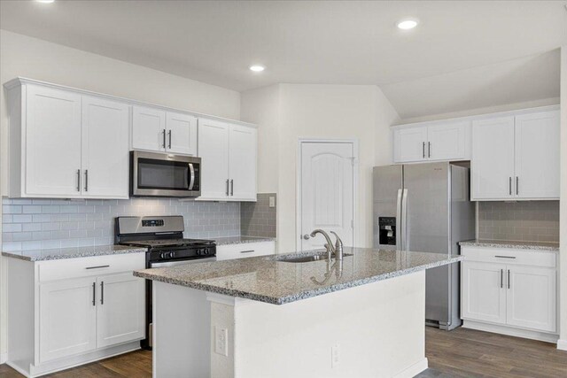 136 Medinah Ln, San Marcos, TX 78666 - kitchen with white cabinets, stainless steel appliances, dark wood-style floors, and a sink