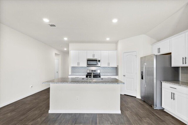 136 Medinah Ln, San Marcos, TX 78666 - kitchen with tasteful backsplash, a kitchen island with sink, stainless steel appliances, white cabinetry, and visible vents